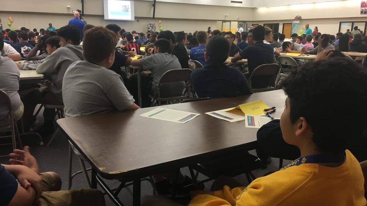 Enzo Vargas, front, and Jimmy Sperry, seventh-graders at Jardine Middle School, watch a kickoff ceremony for BAASE (Better Academics and Social Excellence). The new group hopes to inspire boys of color to enroll in honors and advanced-level classes and prepare for college.