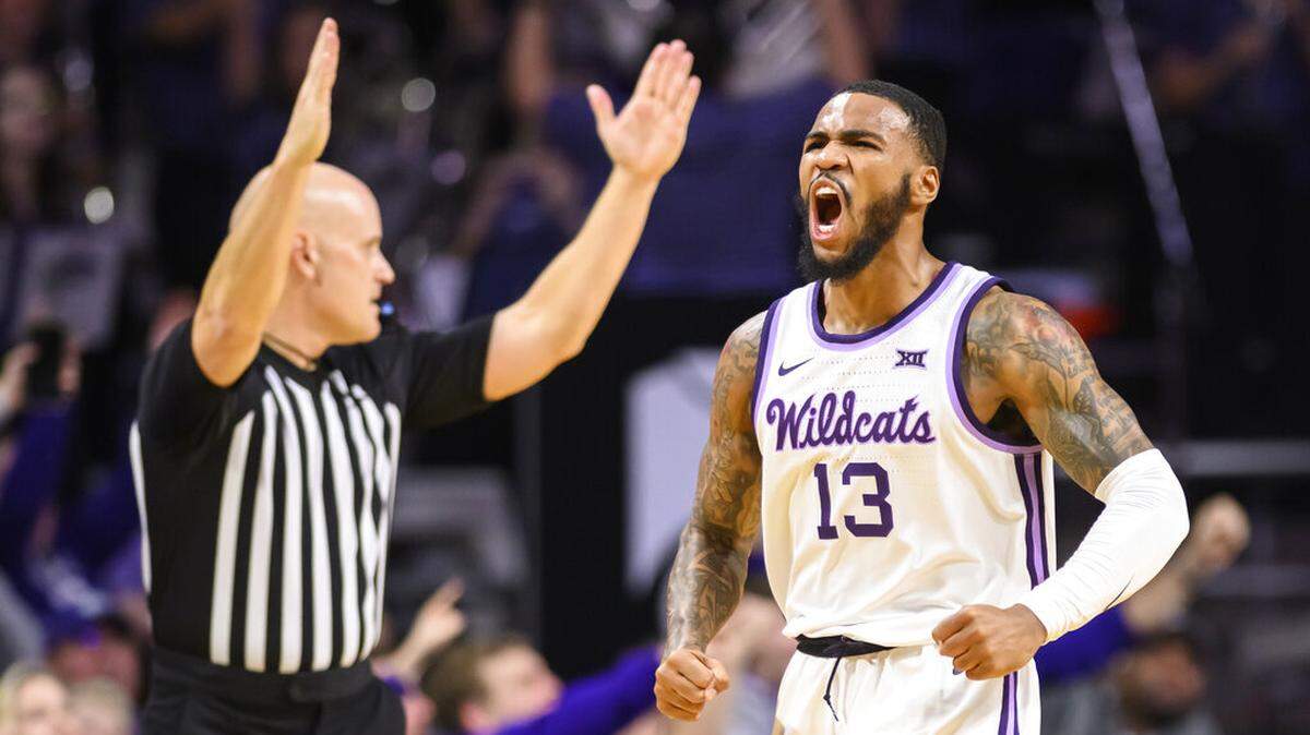 Kansas State guard Desi Sills (13) celebrates a three-point basket against Oklahoma State during the first half of an NCAA college basketball game in Manhattan, Kan., Tuesday, Jan. 10, 2023. (AP Photo/Reed Hoffmann)