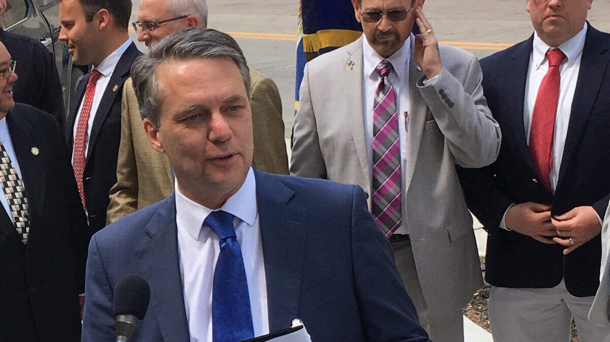 Gov. Jeff Colyer before signing a bill Monday to allow Kansas bars and restaurants to serve alcohol beginning at 6 a.m.