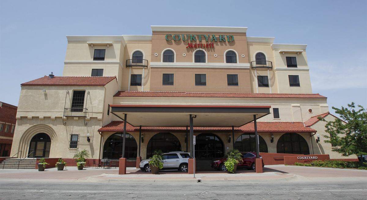 The signs at the Courtyard by Marriott at Old Town were being dismantled on Wednesday in preparations for new ones. More remodeling will happen later this year.