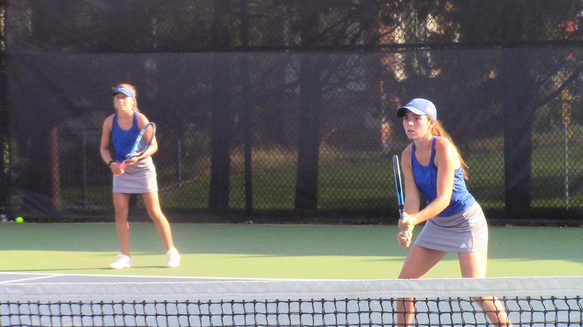 The sister duo of Emma Sinclair (right) and Sarah Sinclair (left) teamed up late in the season and won a Class 5A regional championship in doubles on Friday.