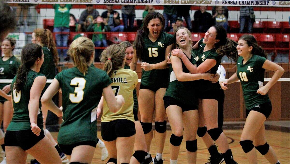 Bishop Carroll’s Riley Daugherty (second right) and Ella Larkin (third right) were chosen to the Class 5A All-Tournament volleyball team in 2018.