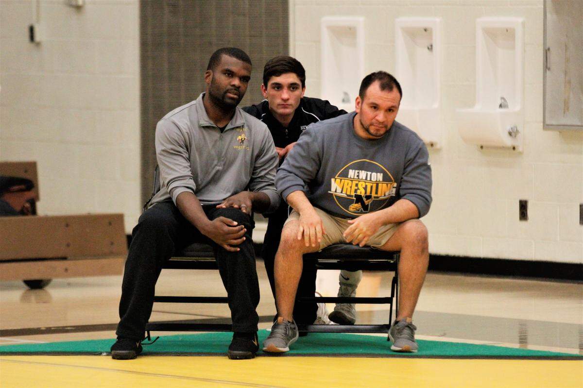 Newton wrestling coaches and senior Grant Treaster