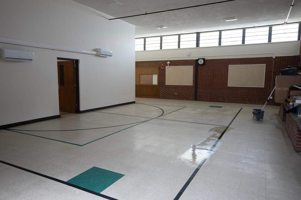 Developer Tom George is putting the finishing touches on new apartments at the former Blackbear Bosin Academy, which will be ready for 23 renters in July.