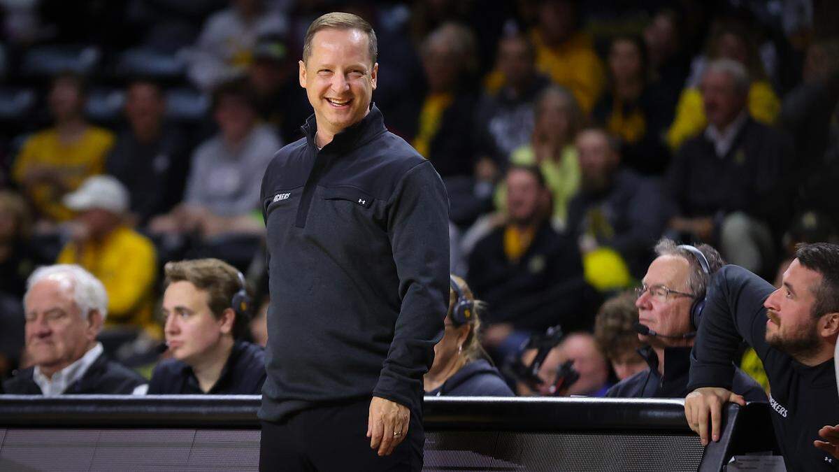 Wichita State men’s basketball coach Paul Mills smiles during a victory over Montana State.