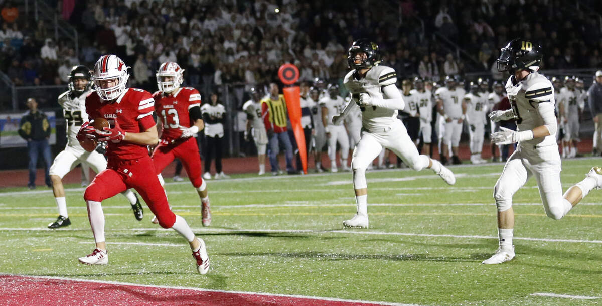 Maize’s Camden Jurgensen sprinted across the goal line for a touchdown Friday night as Maize South defenders give chase. (November 2, 2018)