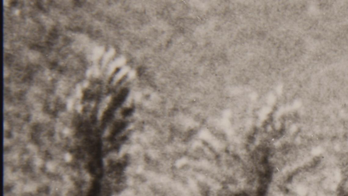 One of the two iconic photographs of Father Emil Kapaun shows him and
another soldier carrying an exhausted GI off a battlefield in Korean,
early in the war. The photo shows Kapaun to the GI's left. The soldier
on the GI's right side was Capt. Jerome A. Dolan;, a medical officer
with the 8th Cavalry regiment.