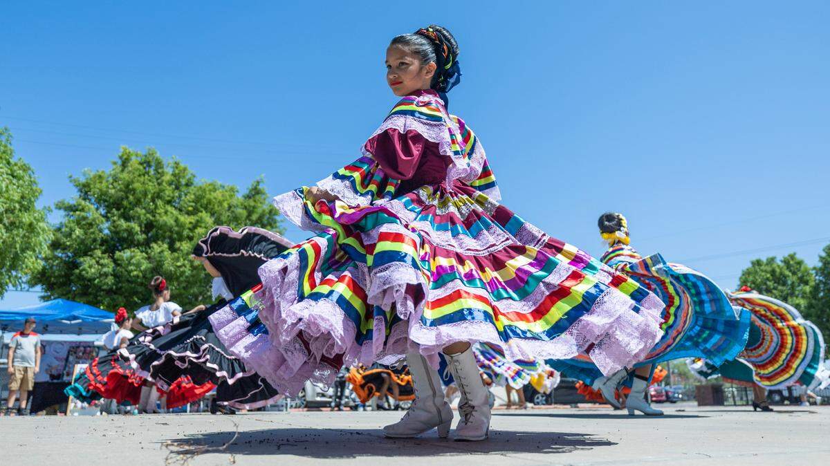 Dancers entertain a large crowd at Nomar Plaza on Sunday during the Open Streets ICT event along 21st Street. The event was filled with vendors, food trucks and entertainment stretching from Broadway to Woodland Park.