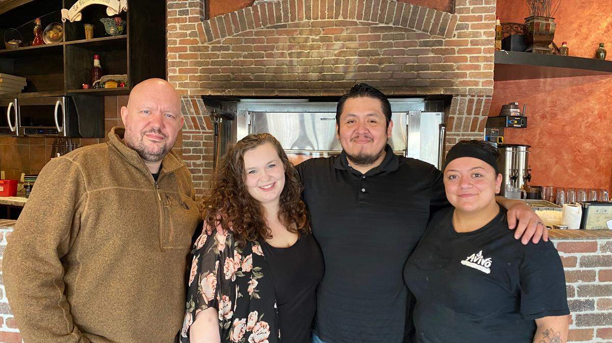 Wichita businessman David Hensley, left, has bought Avivo Brick Oven Pizzeria with his daughter, Adrian Garcia, second from left, and her husband, Andres Garcia, second from right. Micha Still, right, will help run the business.