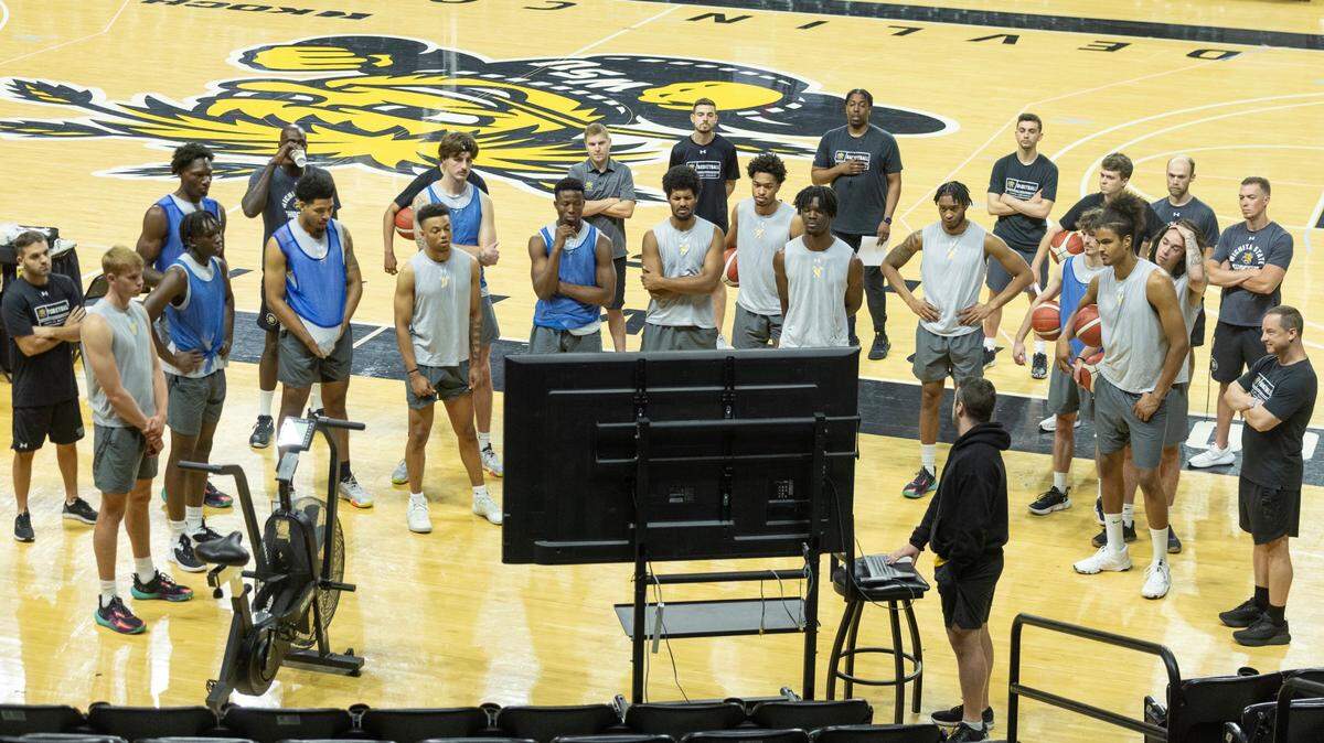 The Wichita State men’s basketball team watches film before a practice at Koch Arena.