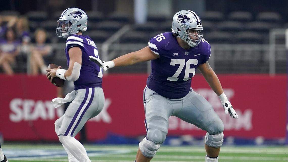 Kansas State offensive lineman Josh Rivas (76) defends as quarterback Skylar Thompson (7) drops back to pass during an NCAA college football game against Stanford in Arlington, Texas, Saturday, Sept. 4, 2021. (AP Photo/Tony Gutierrez)