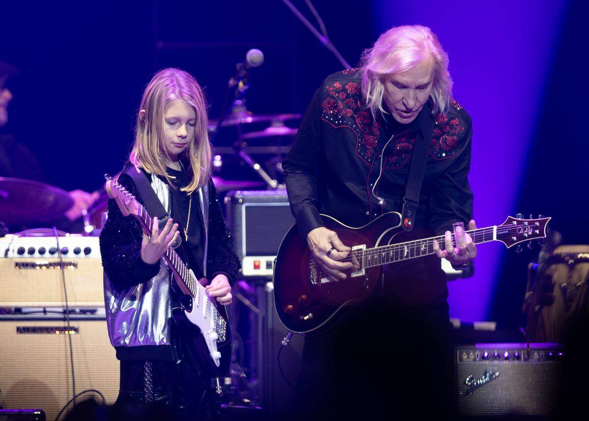 Joe Walsh plays the song “Rocky Mountain Way” with his godson, Roy Orbison III, at Intrust Bank Arena on Saturday night.