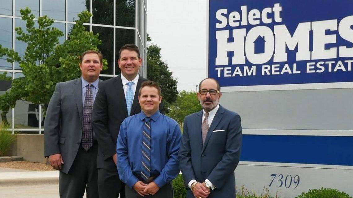 In this August 2017 file photo, Brandon Knowles, left, is shown with part of a group that had new controlling interest in Select Homes Team Real Estate. Partners included Brian Brundage, Adam Bailey and Grant Farha.
