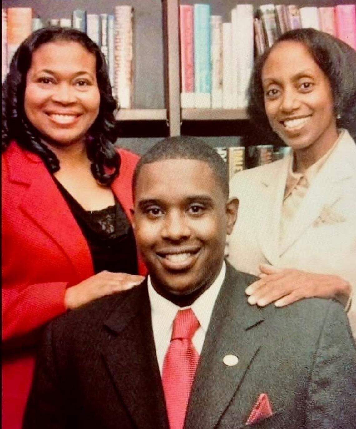 Sen. Oletha Faust-Goudeau (left), former Rep. Melody McCray-Miller (right) and former Sen. Donald Betts (center) smile for a photo together. The three served together in the Kansas Statehouse.