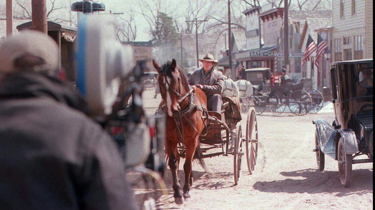 Christopher Walken drives a wagon during shooting of a scene in Hallmark’s “Sarah, Plain and Tall: Winter’s End” at Wichita’s Cowtown in 1999.