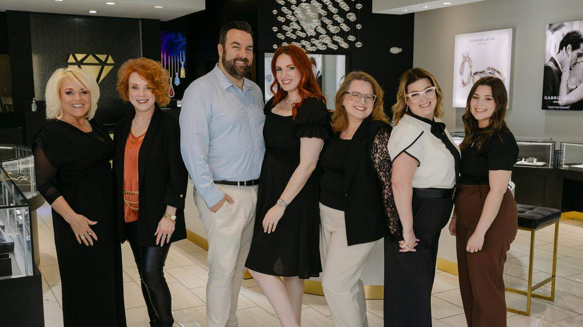 The staff at Powell Jewelry at NewMarket Square includes, from left, Annell Taylor, DeAnn Groner, new owners Ben and Sally Winterman, Melissa Waterbury, Lindsey Dean and Ashlynn Hernandez.