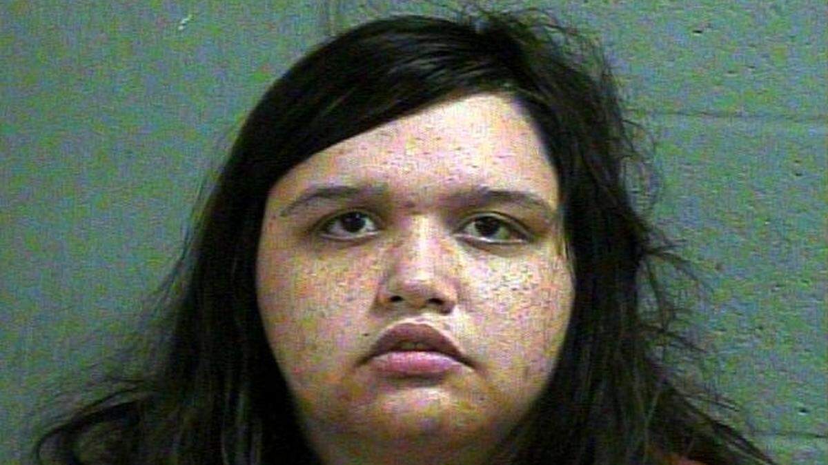 Kristen Elizabeth Jones, 21, was charged with arson in the first degree, desecrating a human corpse and murder in the first degree, according to booking reports.