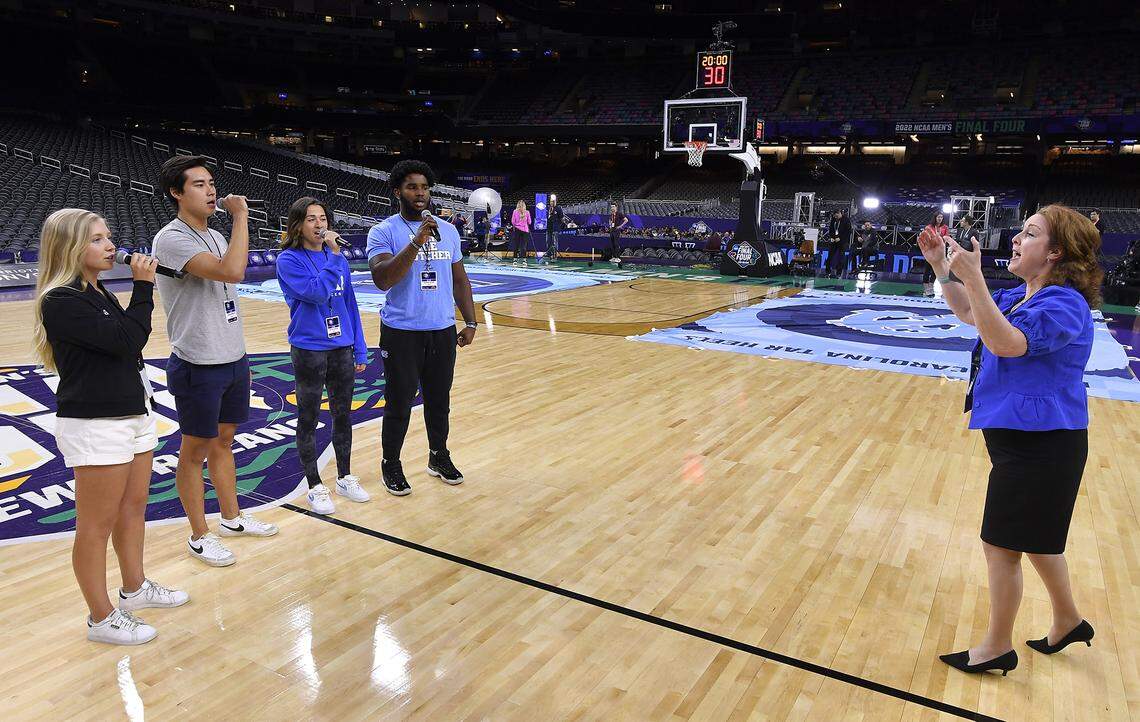 Hanna Hawks, left, a KU sophomore from Wellington, is one of four student athletes from the four universities competing in this year’s Final Four, who will sing the National Anthem before Saturday night’s games at the Superdome in New Orleans. KU will play Villanova in the opening semifinal and North Carolina will play Duke in nightcap. The four rehearsed Thursday evening on the court at the Superdome.