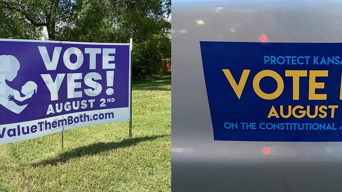 Anti-abortion advocates in favor of a constitutional amendment that would undo the right to an abortion in the Kansas Constitution are displaying YES signs and those not in favor are posting NO signs..