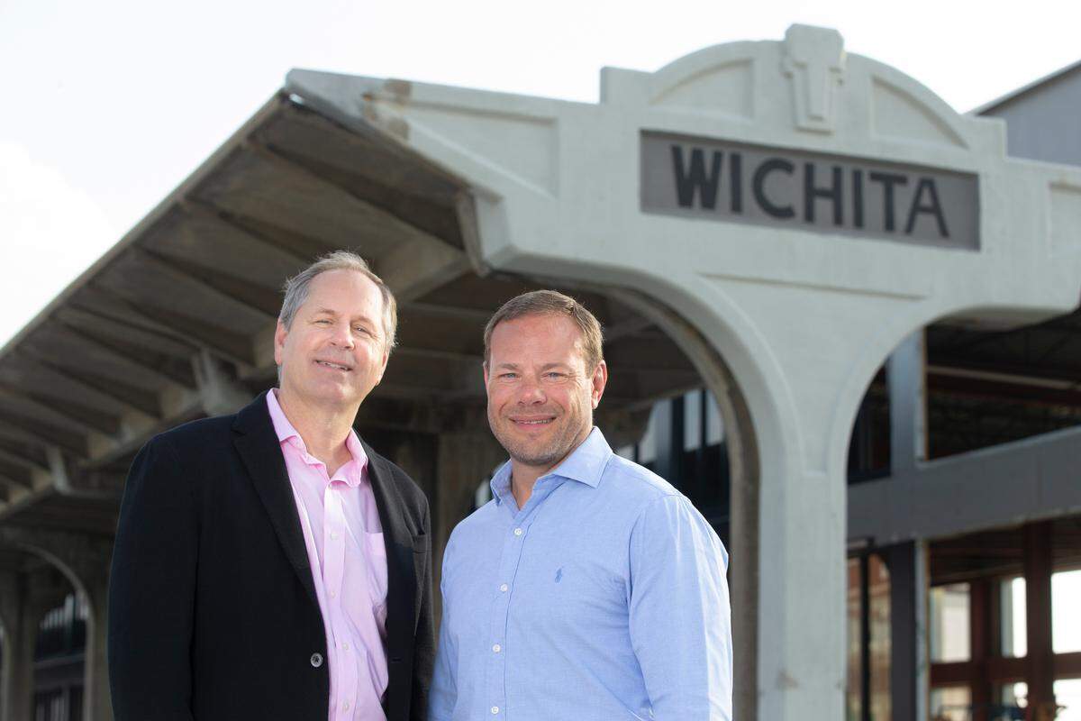 Occidental Management chairman and CEO Gary Oborny, left, and president Chad Stafford stand in front of the train depot sign at Union Station, a property they are redeveloping. The Wichita firm, which has mostly been a local and regional company, has acquired the Overland Park-based Sprint campus. It’s the third-largest corporate campus in the country and is almost three times Occidental’s existing portfolio of 1.7 million square feet.