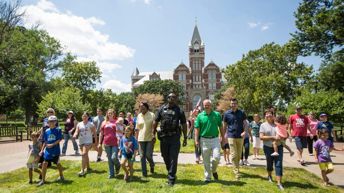 Wichita Police Officer Darren Williams participates in the filming of a lip-sync challenge video outside Friends University on Wednesday. (Aug. 1, 2018)