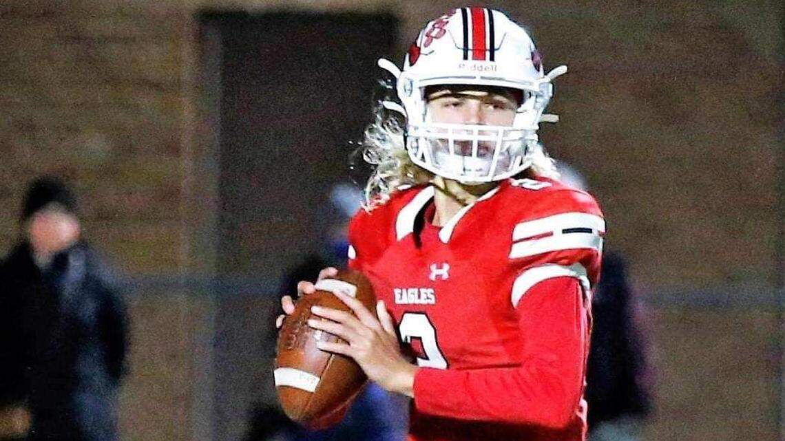 Maize quarterback Avery Johnson prepares to throw a pass in a high school game.