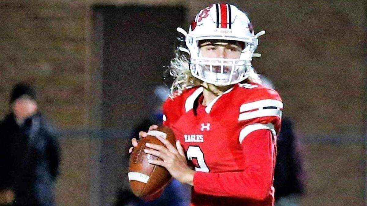 Maize quarterback Avery Johnson prepares to throw a pass in a high school game.