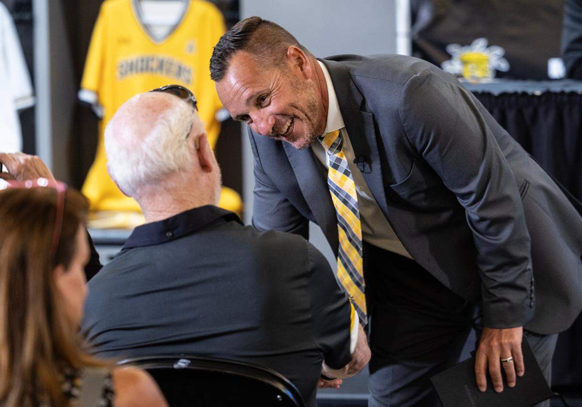 Brian Green meets with legendary college baseball coach Gene Stephenson before Green was introduced as the newest coach of WIchita State baseball during a press event on Wednesday at Eck Stadium. Green comes to WSU from Washington State University. 