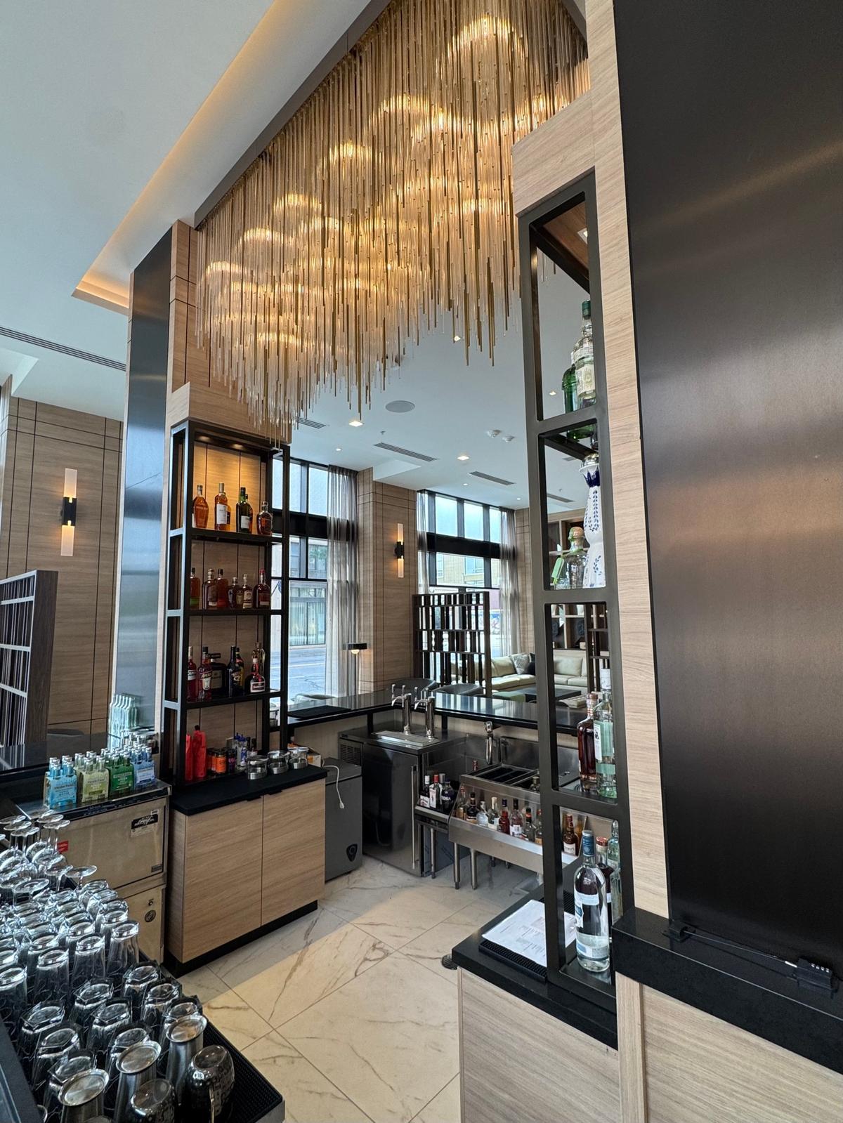 A dramatic chandelier hangs above the bar at the new AC Marriott Hotel in downtown Wichita.