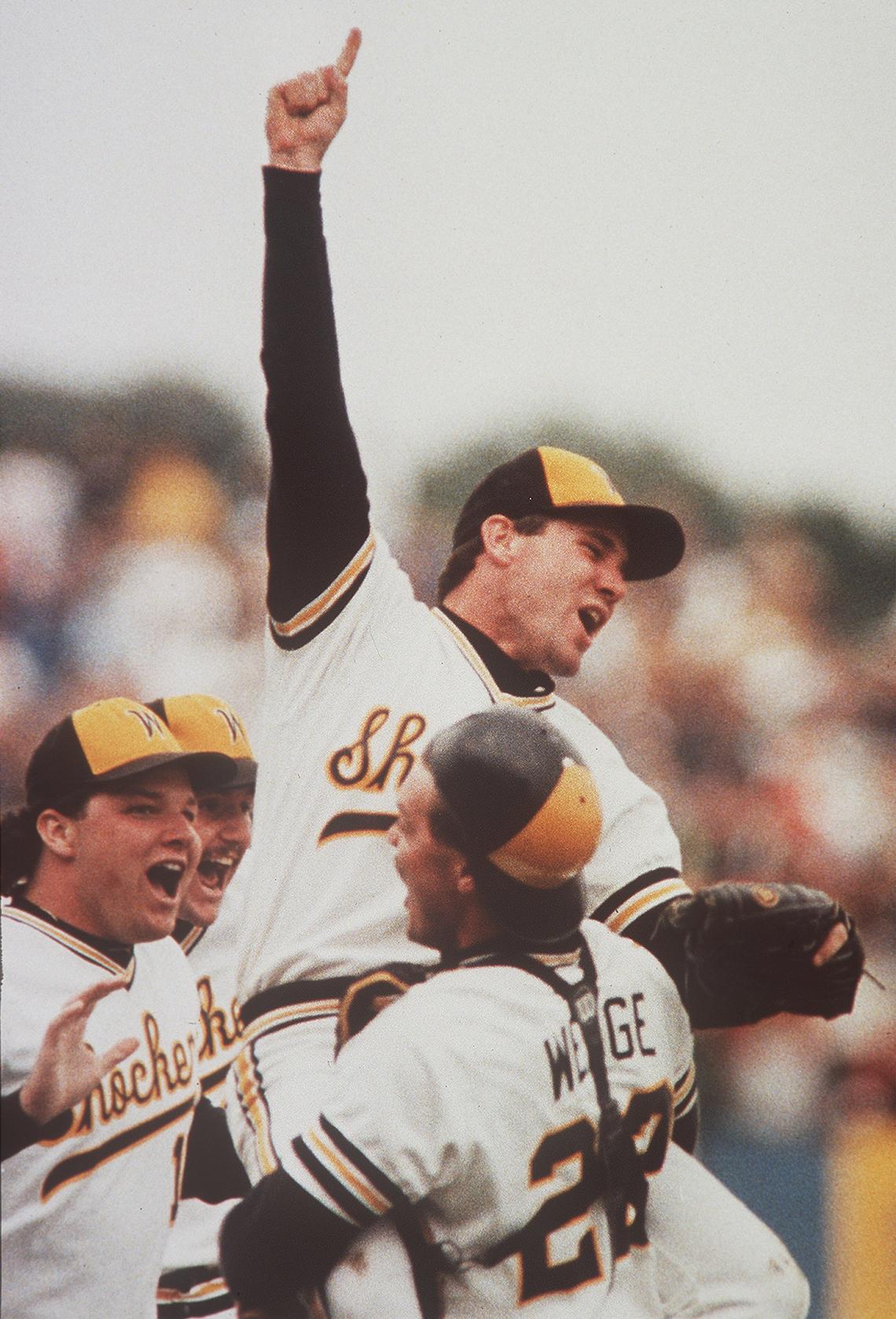 Wichita State pitcher Greg Brummett is held up by catcher Eric Wedge after the final pitch of the 1989 NCAA national championship game against Texas.