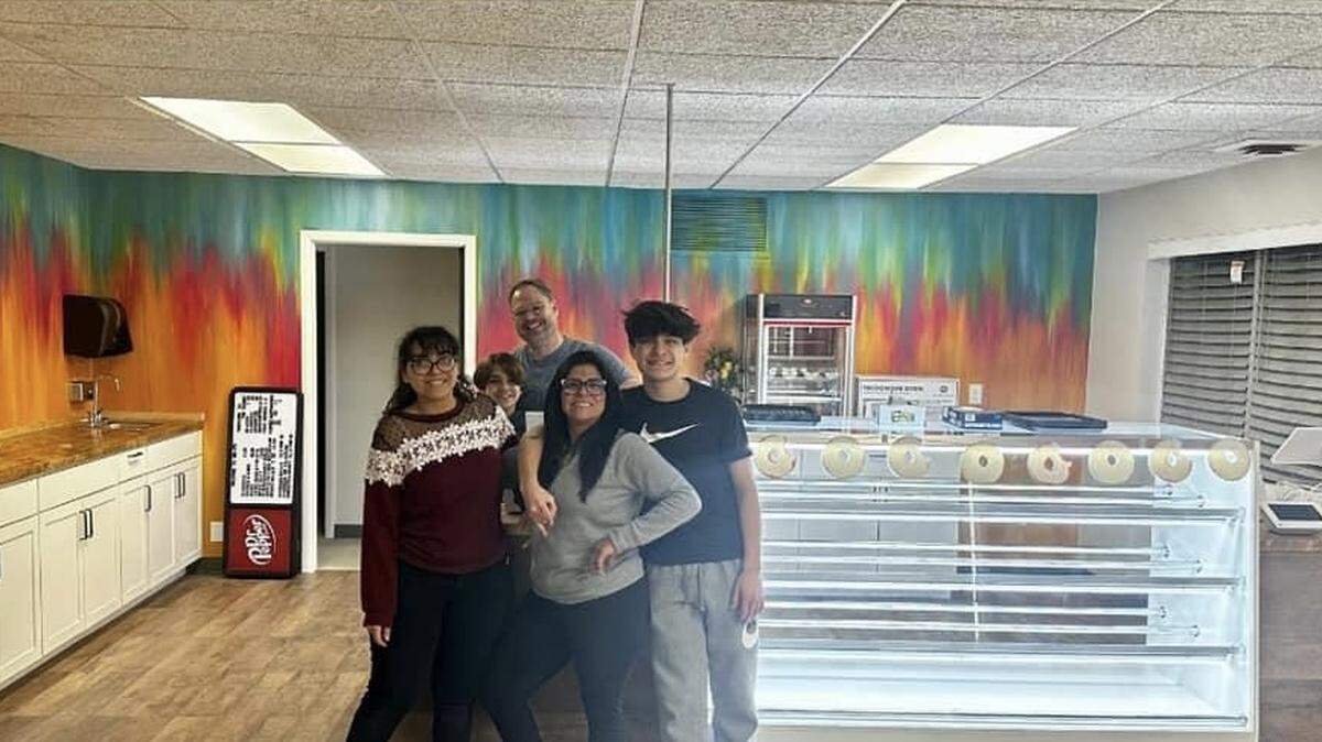 Liz and Jamey Blubaugh, pictured front and back, and their children, from left, Talia, Connley and Jake, are all working at their new Mr. Bs Daylight Donuts in Goddard.