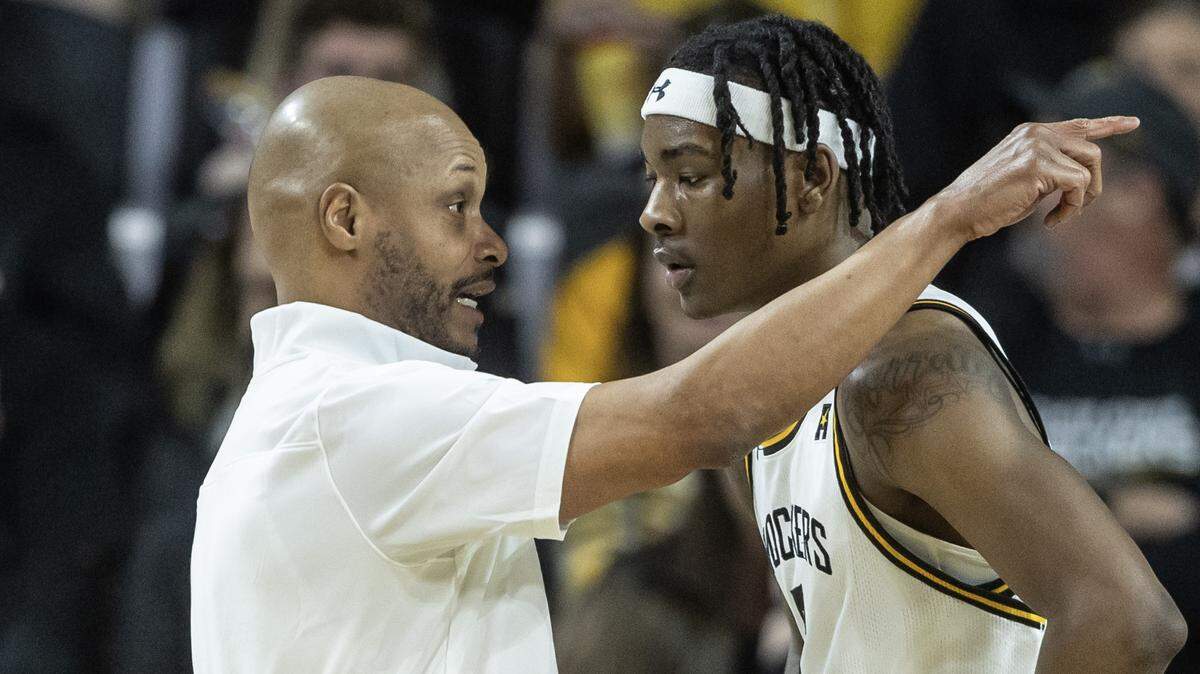 Wichita State coach Isaac Brown gives instructions to Jaron Pierre Jr. during the first half against South Florida on Sunday. It was WIchita State’s final regular season game.