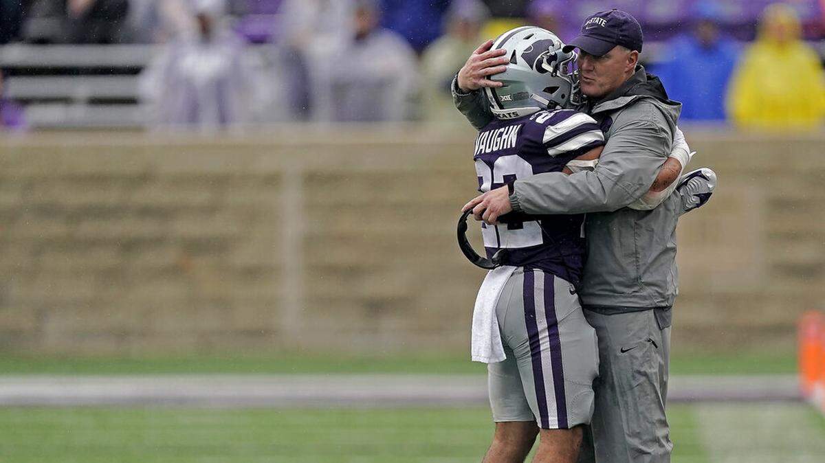 Kansas State head coach Chris Klieman hugs running back Deuce Vaughn after he came out of the game during the second half of an NCAA college football game against Missouri Saturday, Sept. 10, 2022, in Manhattan, Kan. (AP Photo/Charlie Riedel)