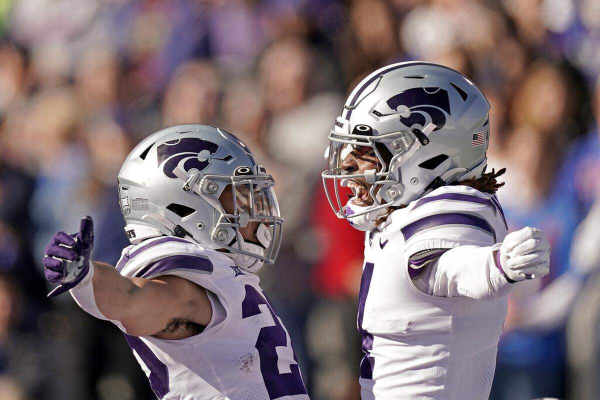 Kansas State wide receiver Malik Knowles, right, celebrates with running back Deuce Vaughn after scoring a touchdown against KU last weekend in Lawrence.