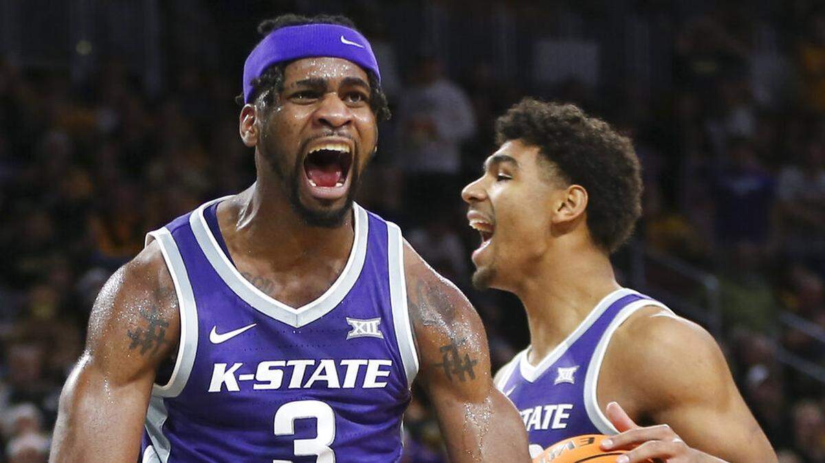 Kansas State guard Selton Miguel yells after dunking during the first half of an NCAA college basketball game against Wichita State, Sunday, Dec. 5, 2021, in Wichita, Kan. (Travis Heying/The Wichita Eagle via AP)