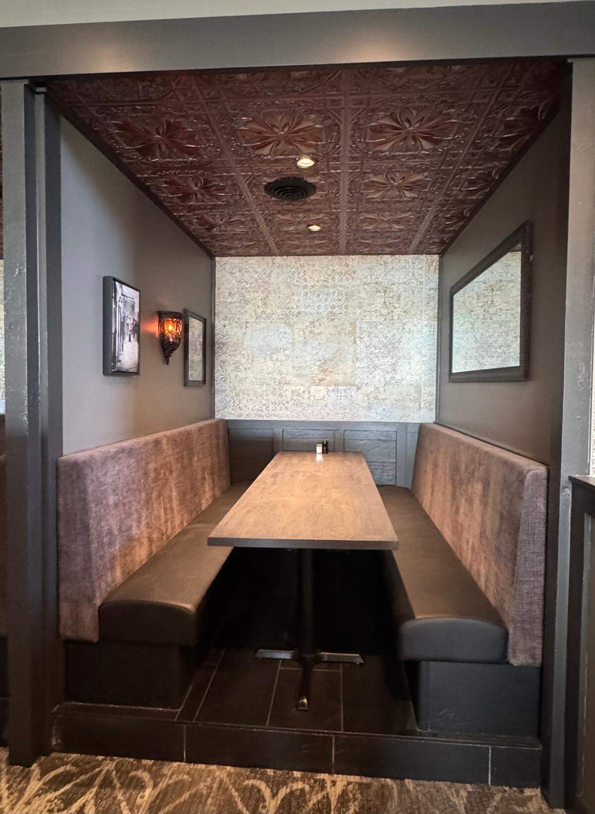 These private booths at the new Todd’s Creole Kitchen will seat eight, and customers can choose to make them more private by closing a curtain.
