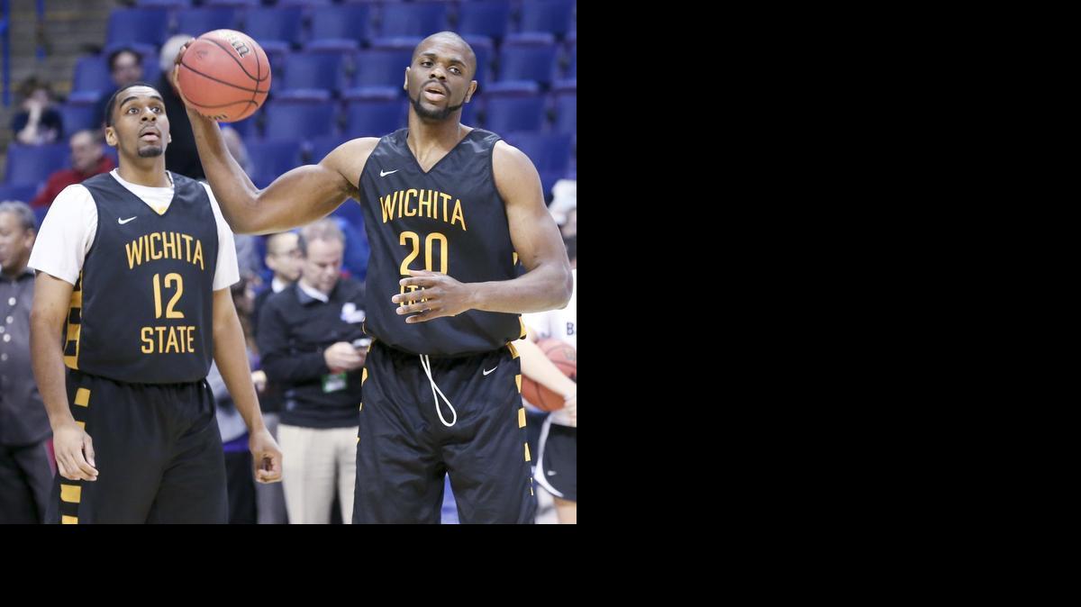 Wichita State's Darius Carter (12) and Kadeem Coleby (20) practice at the Scottrade Center in St. Louis on Thursday. Both will be playing in their first NCAA Tournament games Friday.

