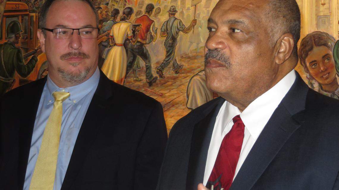 Former Wichita mayor and governor candidate Carl Brewer, right, introduces former Gardner Mayor Chris Morrow as his running mate in front of the Brown v. Board of Education mural at the state Capitol.