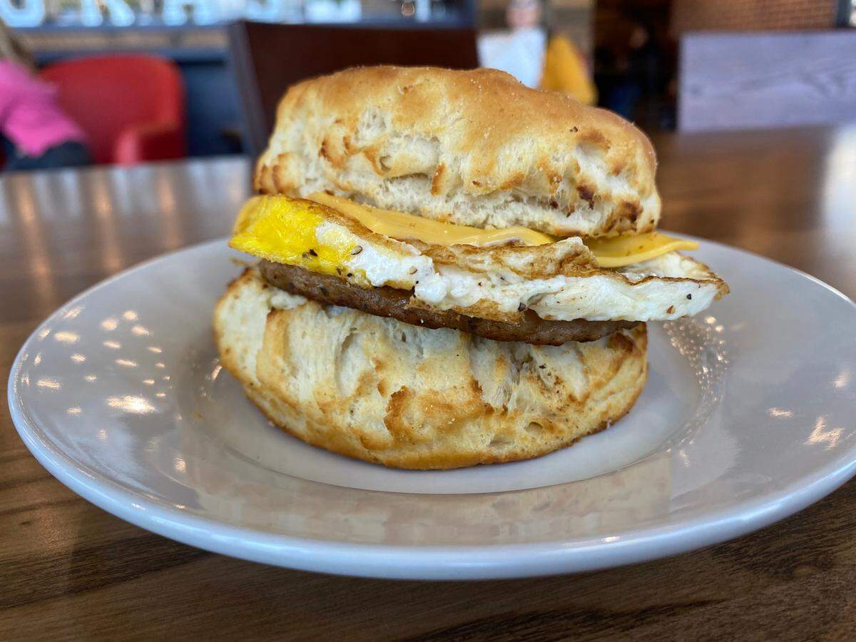 A breakfast sandwich served on biscuit from Mokas Cafe