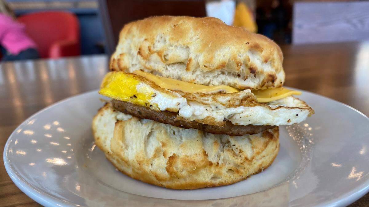 A breakfast sandwich served on biscuit from the new Mokas Cafe