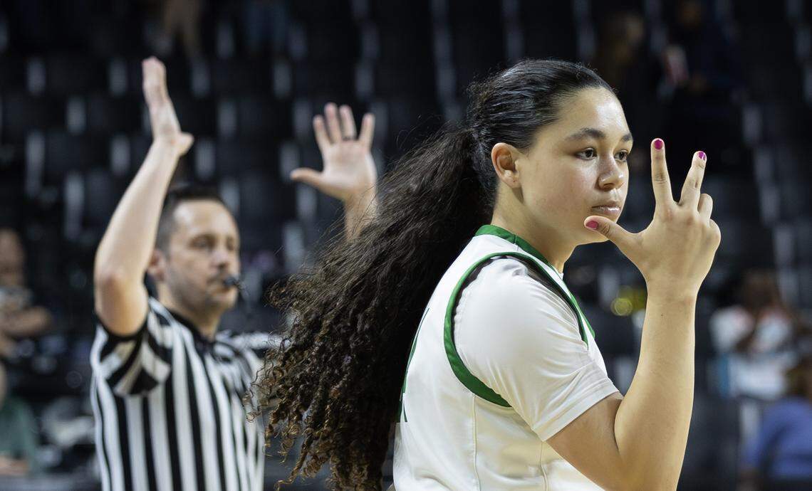 Derby’s Maya Harris hit a three pointers in the fourth quarter against Topeka High on Tuesday at the quarterfinals of the 6A basketball tournament at Koch Arena.
