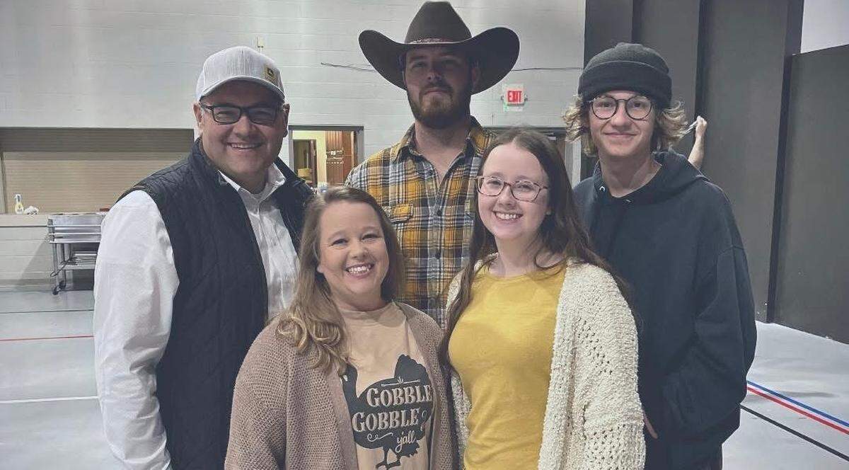 The late Joshua Blick, left, with his family, including, from left, his wife, Candace, son-in-law, Andrew Schmitt, daughter, Abbagail Schmitt, and son, Pierson.