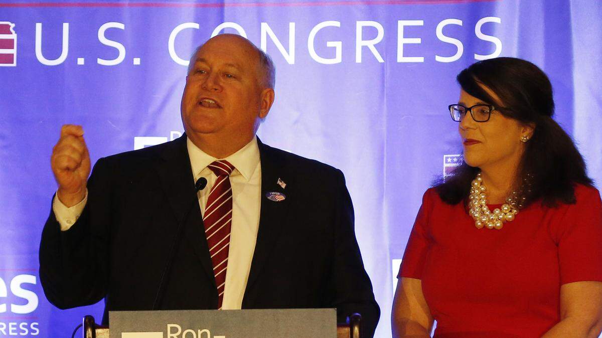 Ron Estes celebrates his win for U.S. Representative for Kansas’s 4th congressional district over James Thompson. On stage with Estes is his wife Susan and his children.