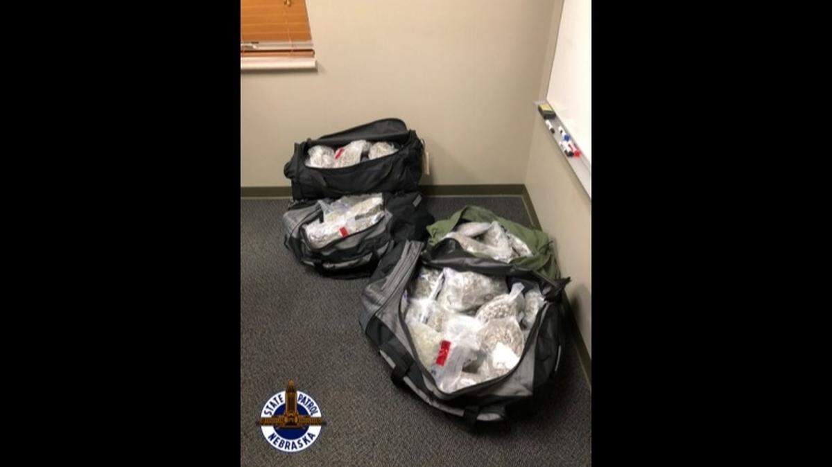 Two men were arrested after they were found with 94 pounds of marijuana in their truck, police say.