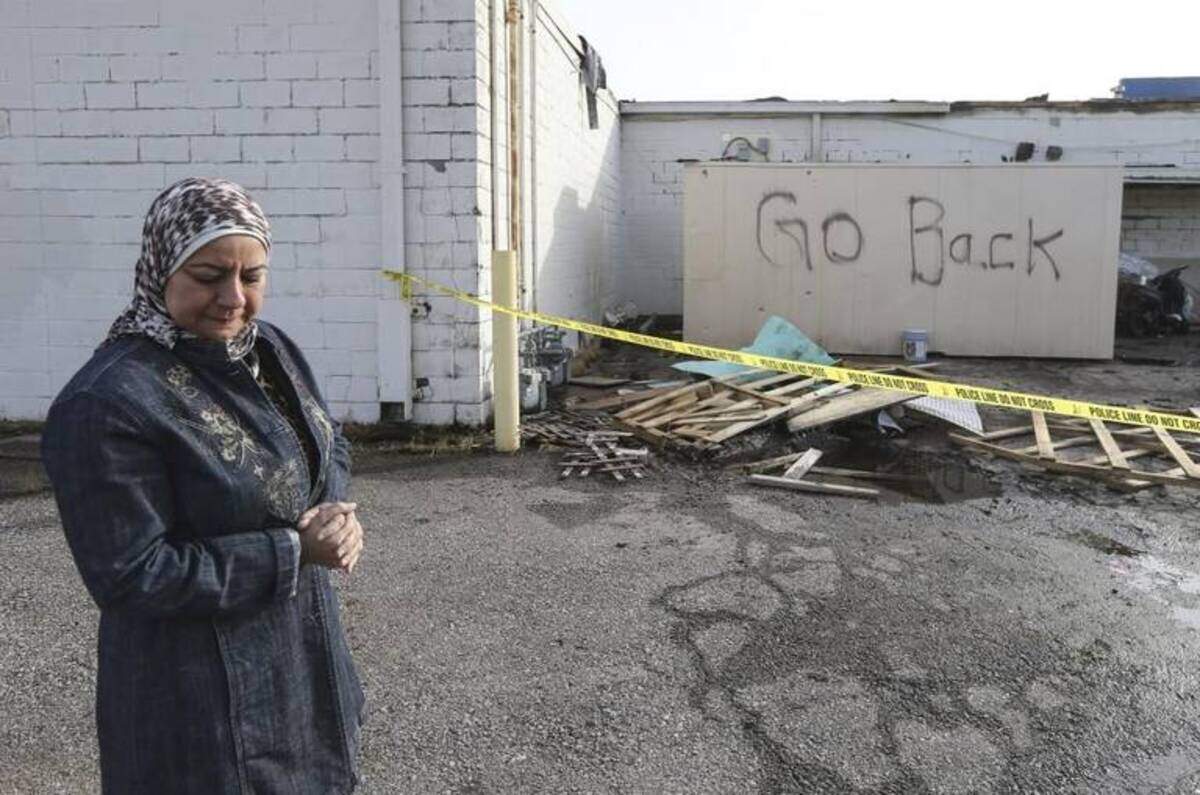 Ranya Taha found the words “Go back” spray painted on a back storage shed after an arson fire in 2017.