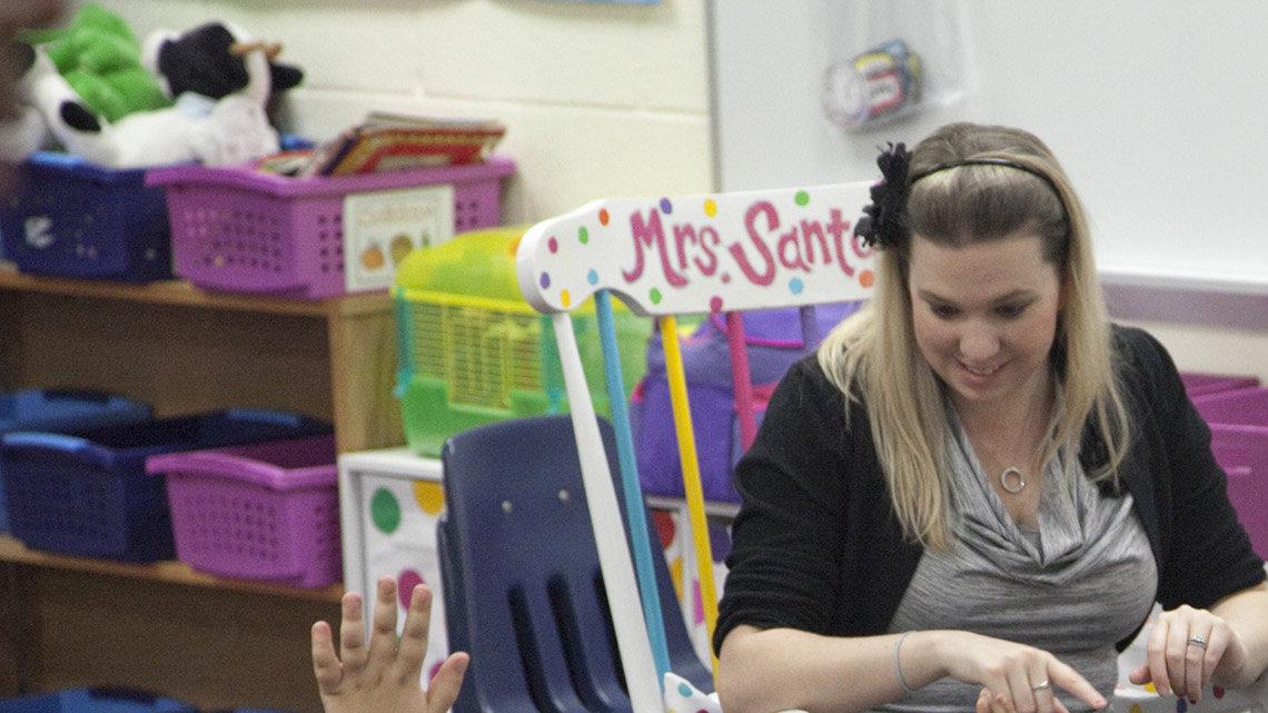 KIndergarten teacher Courtney Santore talks with her class at the new Spaght Multimedia Magnet Elementary School, the latest bond-issue school to open, Wednesday, Jan. 4, 2011. It was the kids' first day in the new building.
