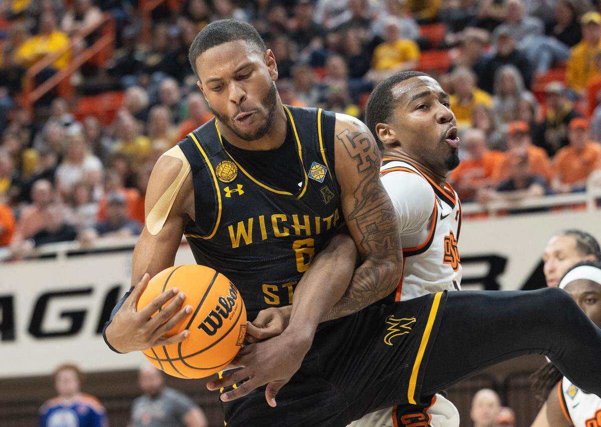 Wichita State’s Corey Washington fights for a rebound against Oklahoma State’s Bryce Thompson during the first half of their first round NIT game in Stillwater, Ok.