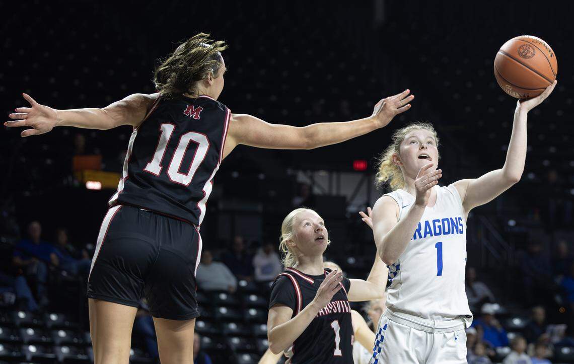 Halstead’s Addison Wills, right, shoots against Maryville’s Kacy Roesch during the second quarter of their class 3A quarter final game at Koch Arena on Wednesday.