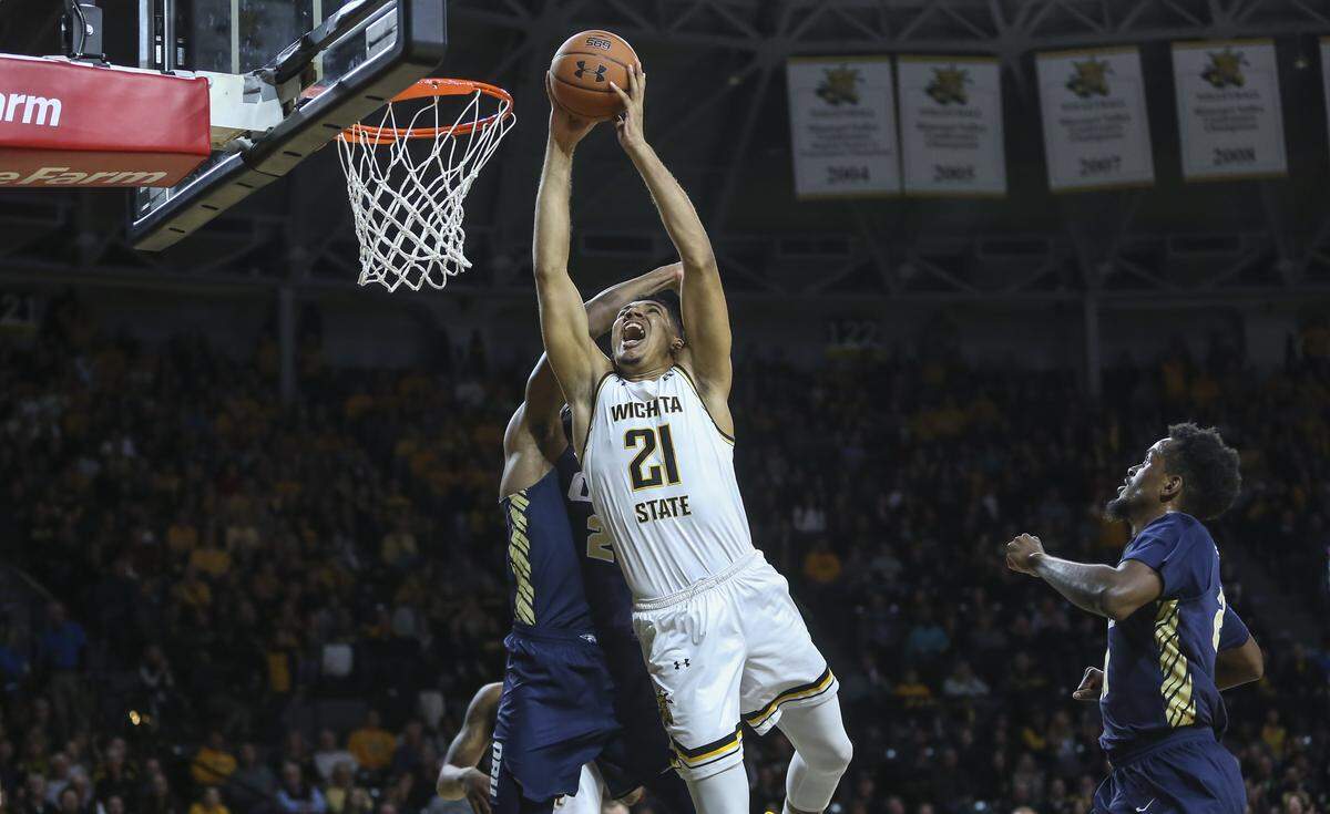 Wichita State forward Jaime Echenique makes a shot and gets fouled by Oral Roberts forward Emmanuel Nzekwesi during the first half of their game at Koch Arena on Wednesday.