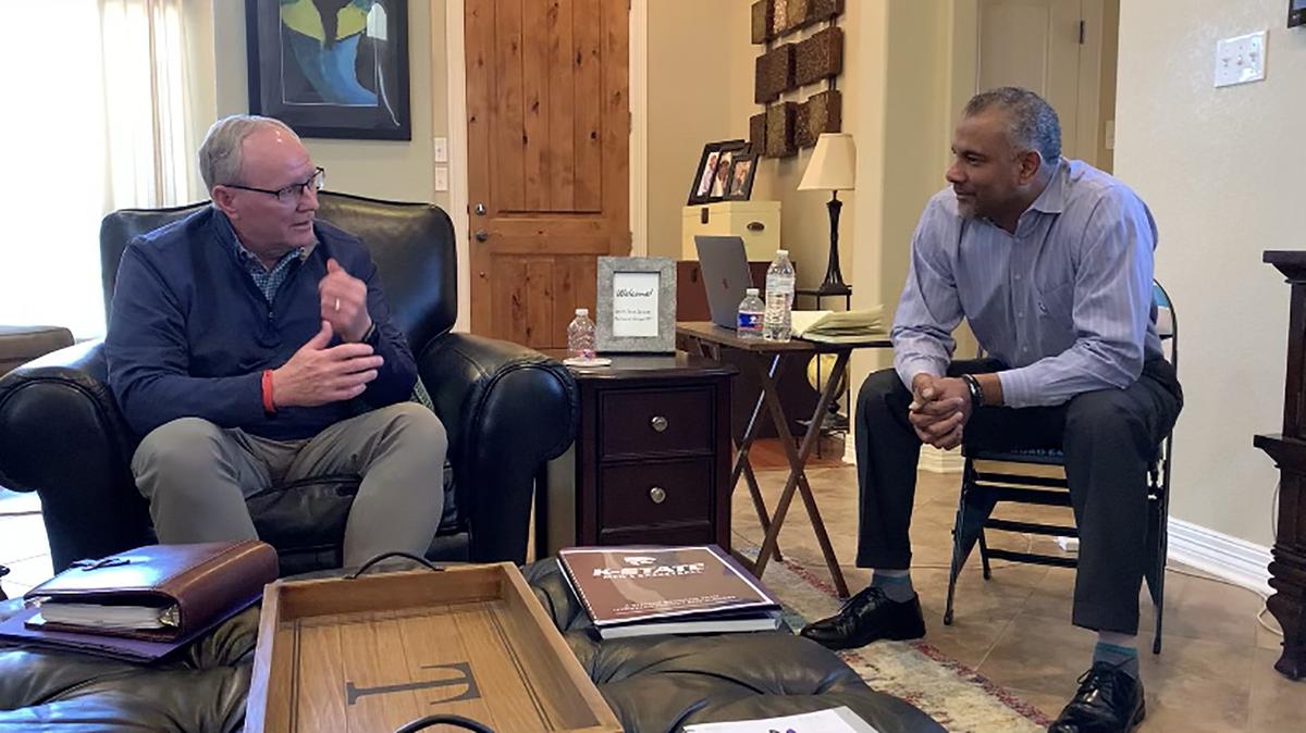 Kansas State athletics director Gene Taylor speaks with Jerome Tang during a job interview in Waco, Texas.